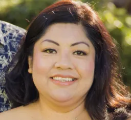 A woman smiling