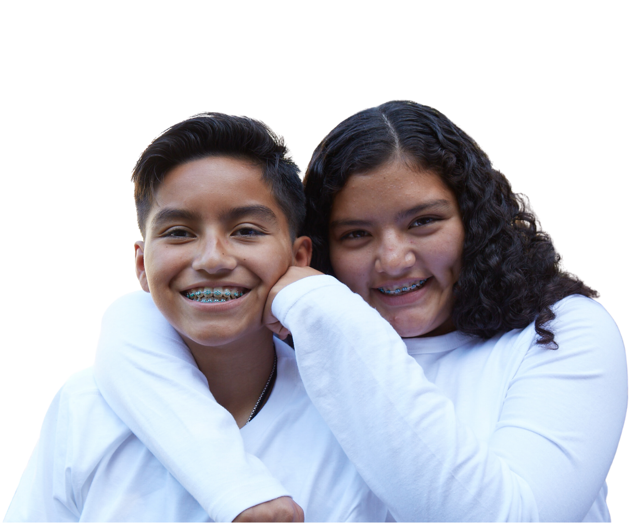 Two smiling siblings